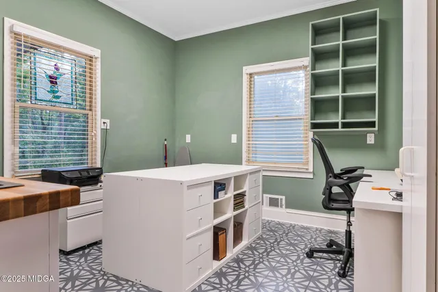 a kitchen that has a sink and a stove in it