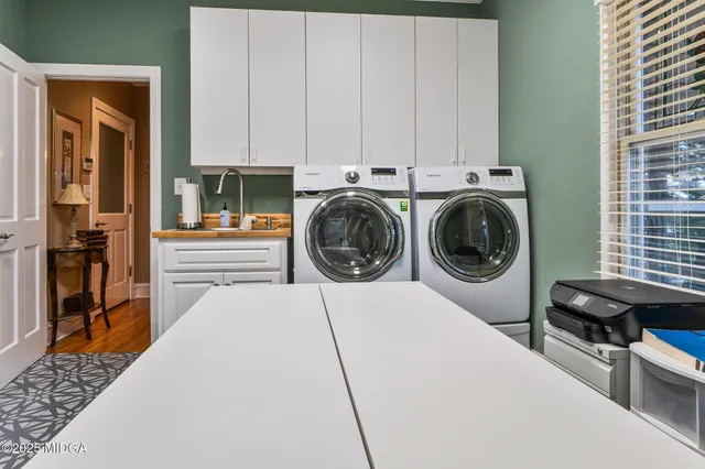 a bathroom with a toilet sink and shower