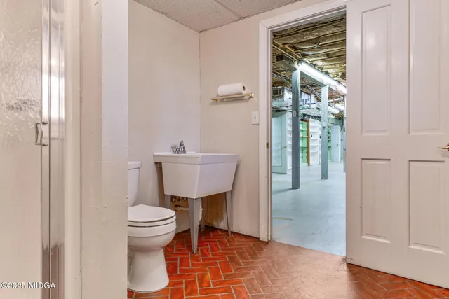 a view of dirt yard with a large trees