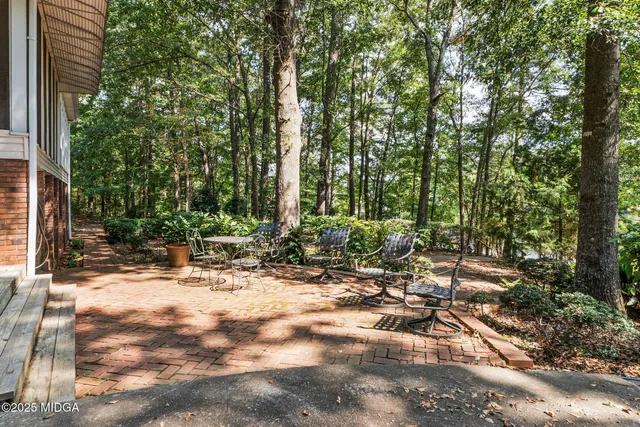 front view of a house with a tree