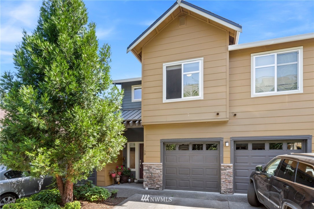 130 Cougar Ridge Road Northwest, Unit 1502 Issaquah, WA 98027 - Photo 1 of 28 a front view of a house with parking