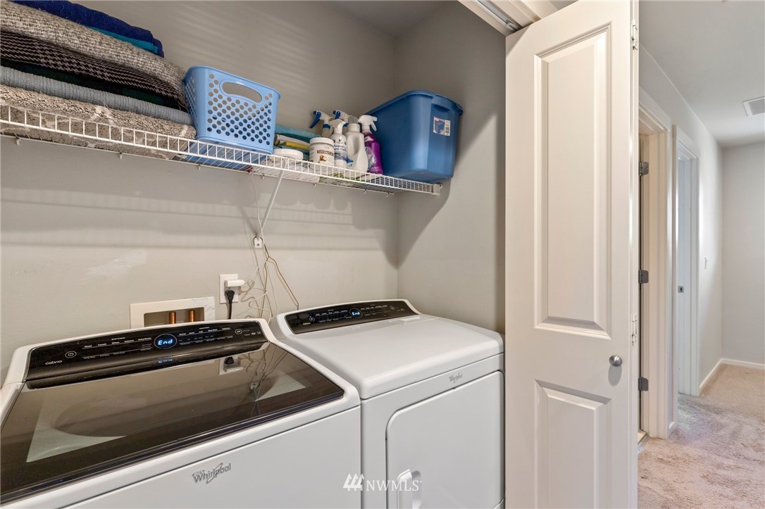 130 Cougar Ridge Road Northwest, Unit 1502 Issaquah, WA 98027 - Photo 23 of 28 a utility room with dryer and washer