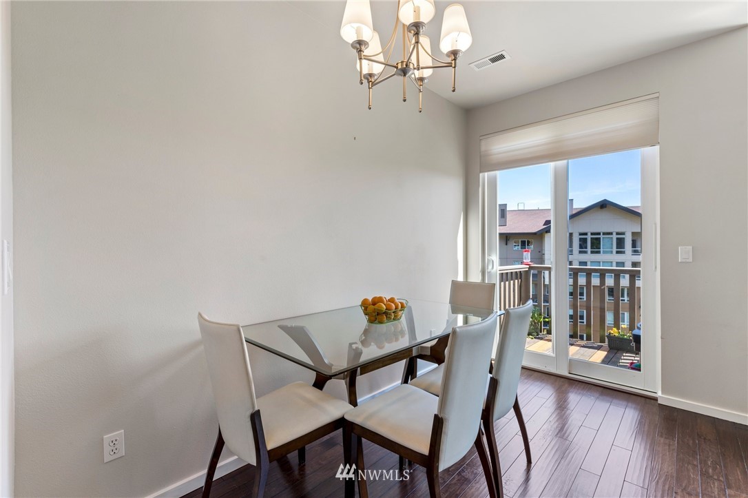 130 Cougar Ridge Road Northwest, Unit 1502 Issaquah, WA 98027 - Photo 7 of 28 a view of a dining room with furniture and wooden floor