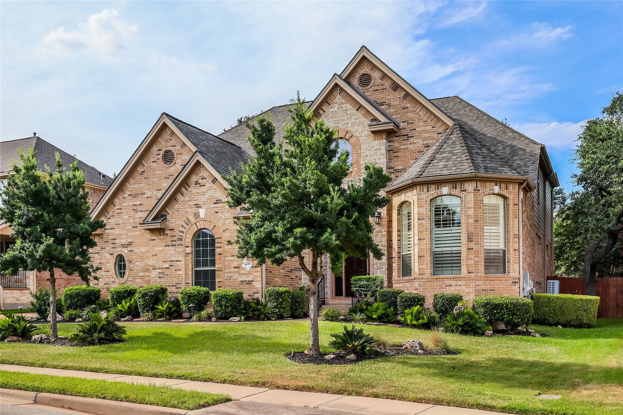 408 Ridgetop Bend Cedar Park, TX 78613 - Photo 2 of 40 A classic brick exterior with varied architectural elements offers timeless curb appeal.