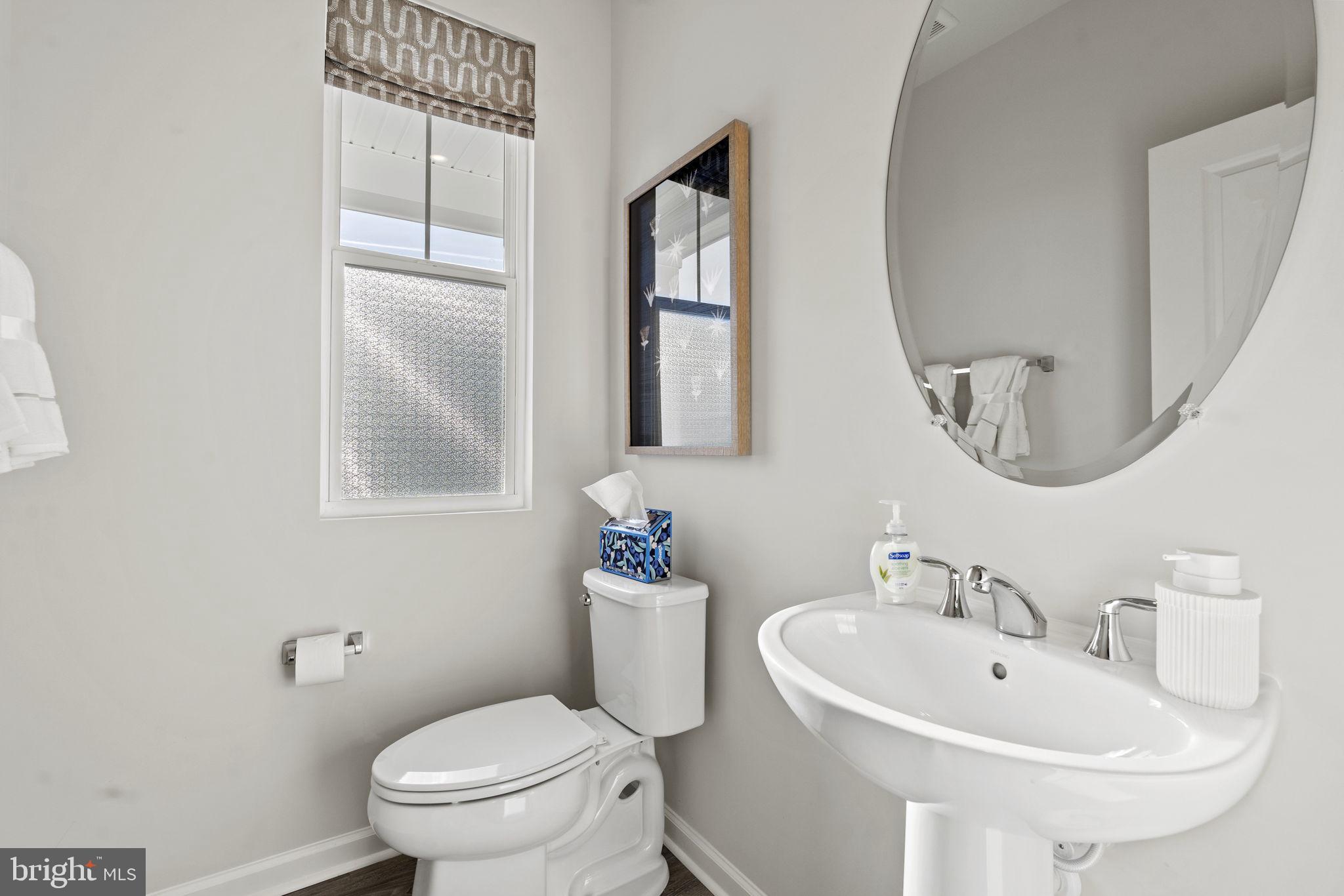 93 Taft Avenue Ranson, WV 25438 - Photo 11 of 46 a bathroom with a toilet a sink and mirror