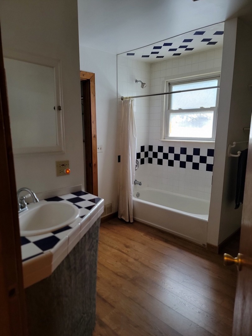 63 West Richton Road Steger, IL 60475 - Photo 26 of 48 a bathroom with a sink a toilet a mirror and shower