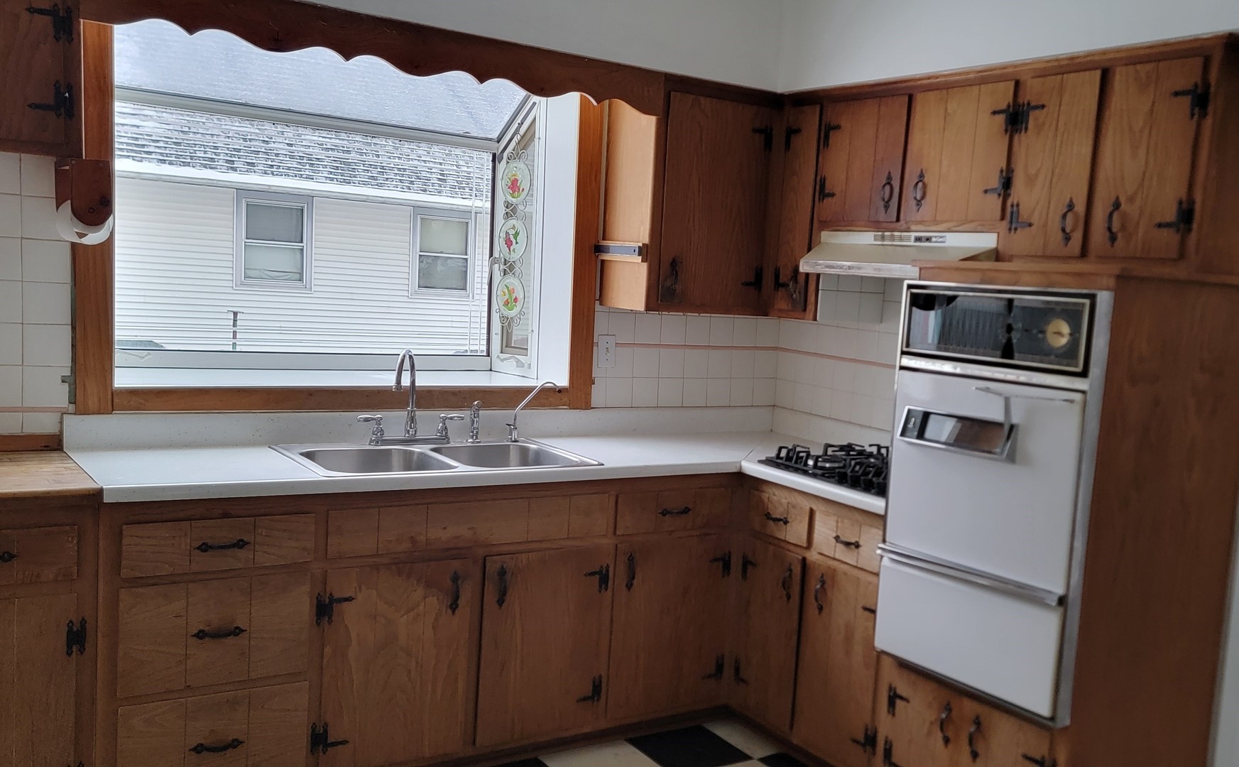 63 West Richton Road Steger, IL 60475 - Photo 9 of 48 a kitchen with stainless steel appliances granite countertop a sink stove and cabinets