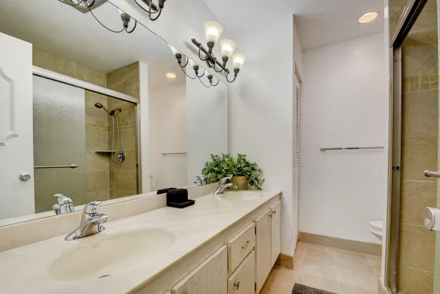a bathroom with a sink vanity and a mirror