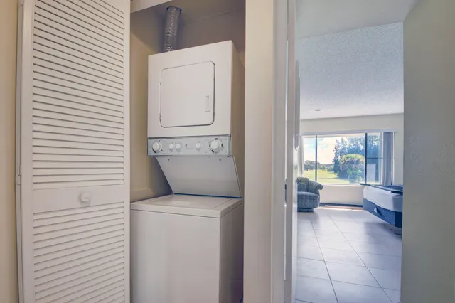 a view of a livingroom with furniture and chandelier