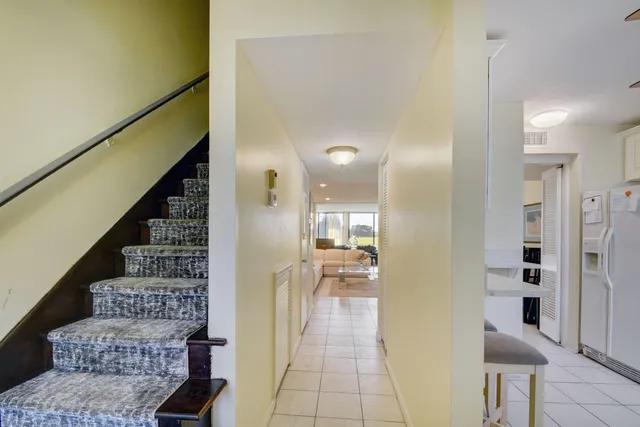 a view of a hallway with seating area