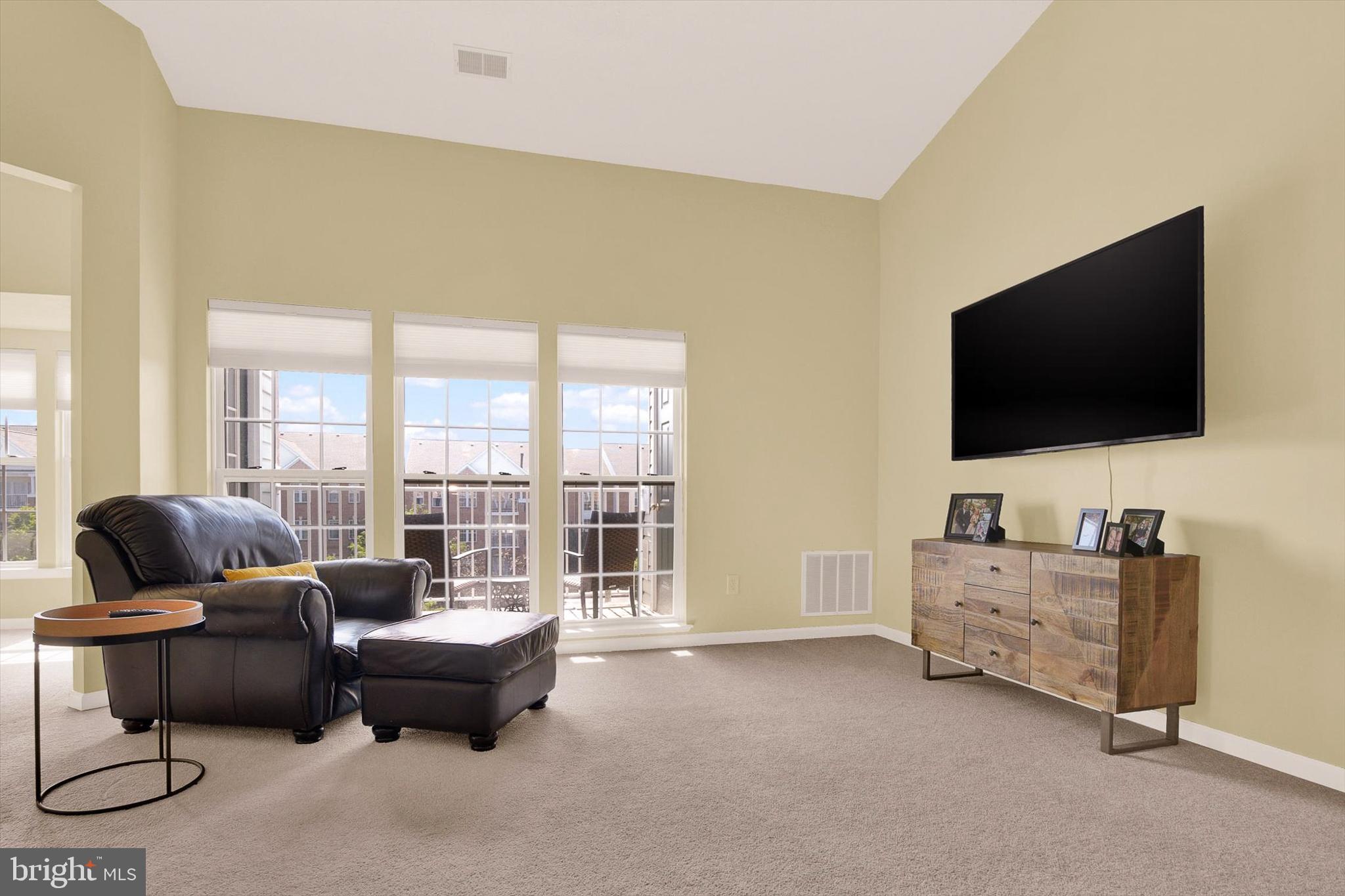 5497 Glenthorne Court, Unit 5497 Rosedale, MD 21237 - Photo 3 of 25 Living room overlooks the covered balcony