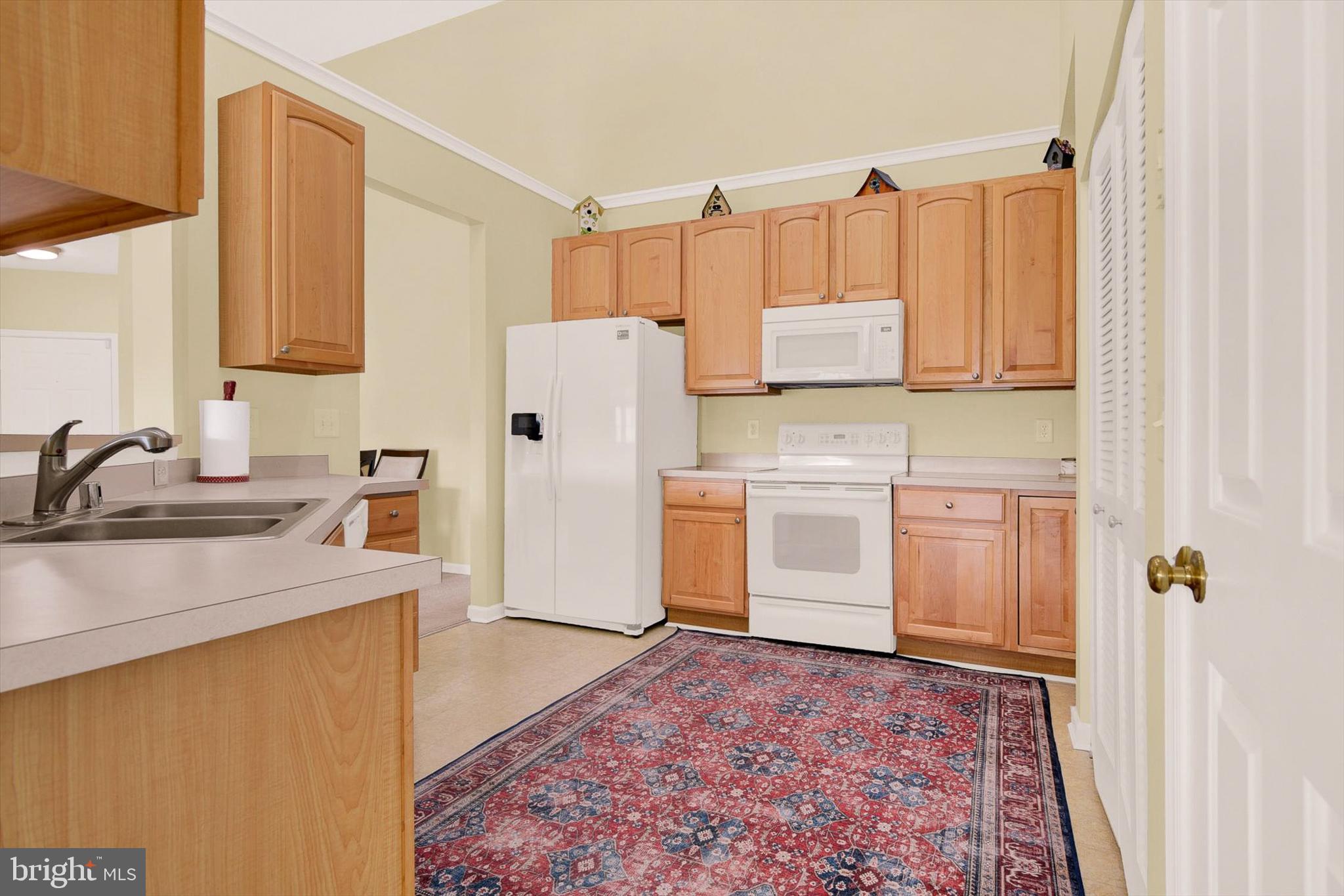 5497 Glenthorne Court, Unit 5497 Rosedale, MD 21237 - Photo 6 of 25 Kitchen features 42" cabinetry & sleek appliances