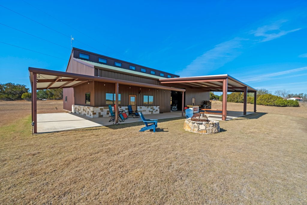 3259 Schumann Road Stonewall, TX 78671 - Photo 28 of 35 a view of a outdoor space with porch and patio