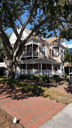 a front view of a building with a yard
