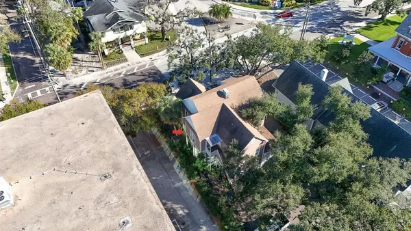 an aerial view of a house with outdoor space