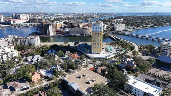an aerial view of a house with a lake view