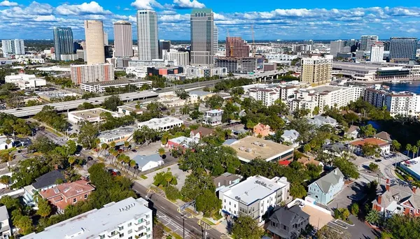 an aerial view of a house with a ocean view