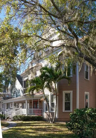 a front view of a building with a garden