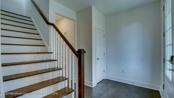 a view of entryway with wooden floor