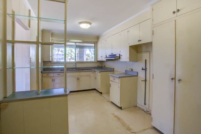 8595 Elepaio Road Kekaha, HI 96752 - Photo 12 of 25 a kitchen with a sink stainless steel appliances cabinets and a window