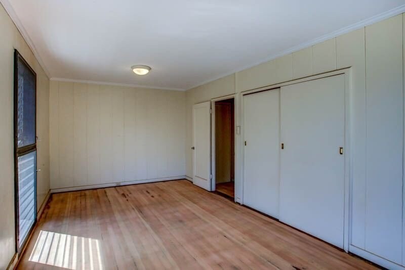 8595 Elepaio Road Kekaha, HI 96752 - Photo 14 of 25 a view of an empty room with wooden floor