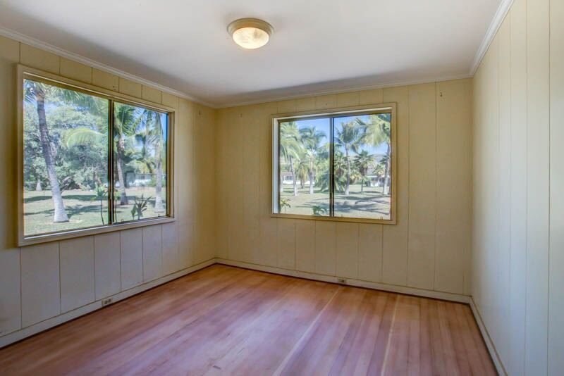 8595 Elepaio Road Kekaha, HI 96752 - Photo 17 of 25 a view of an empty room with wooden floor and a window