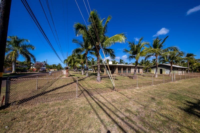 8595 Elepaio Road Kekaha, HI 96752 - Photo 4 of 25 a view of multiple houses with a yard