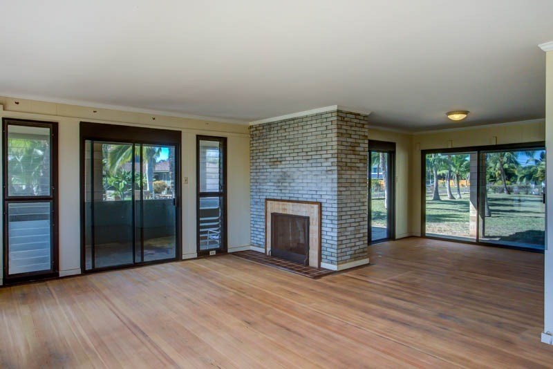 8595 Elepaio Road Kekaha, HI 96752 - Photo 9 of 25 an empty room with floor to ceiling window and wooden floor