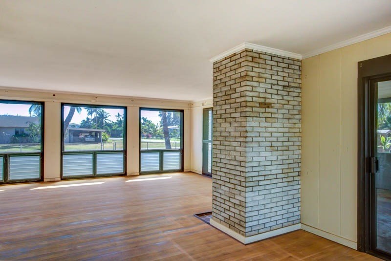 8595 Elepaio Road Kekaha, HI 96752 - Photo 10 of 25 a view of an empty room with wooden floor and fan