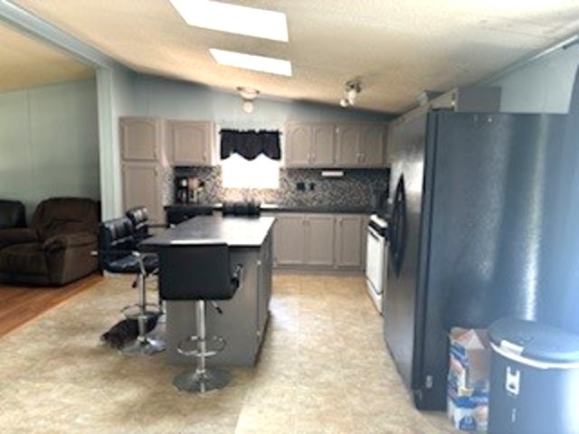 3490 South Dwight Road Mazon, IL 60444 - Photo 5 of 17 a kitchen with stainless steel appliances granite countertop a sink refrigerator and cabinets