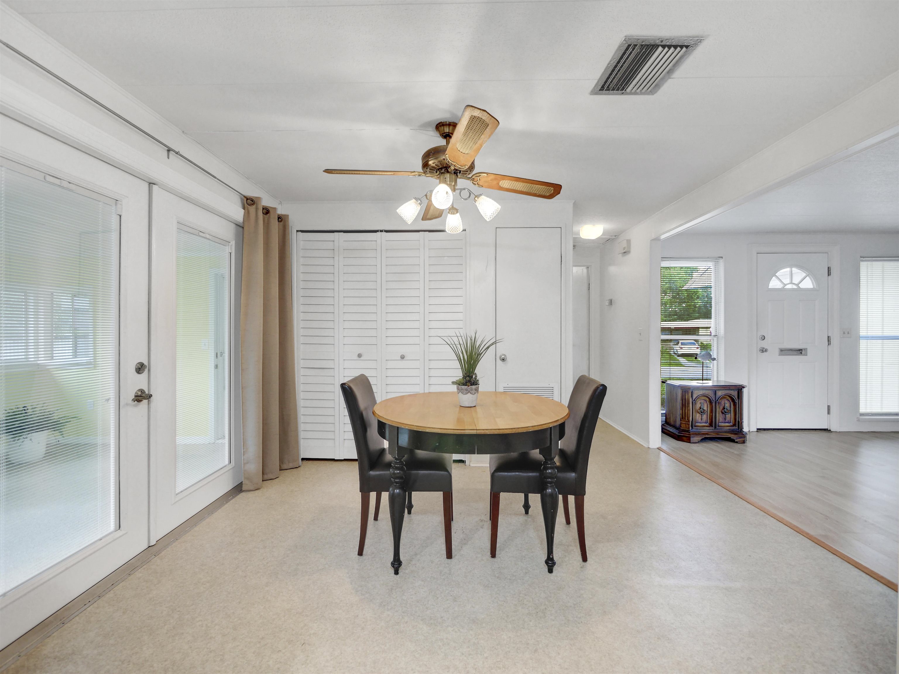 879 Palermo Road St. Augustine, FL 32086 - Photo 11 of 38 a view of a dining room with furniture and chandelier