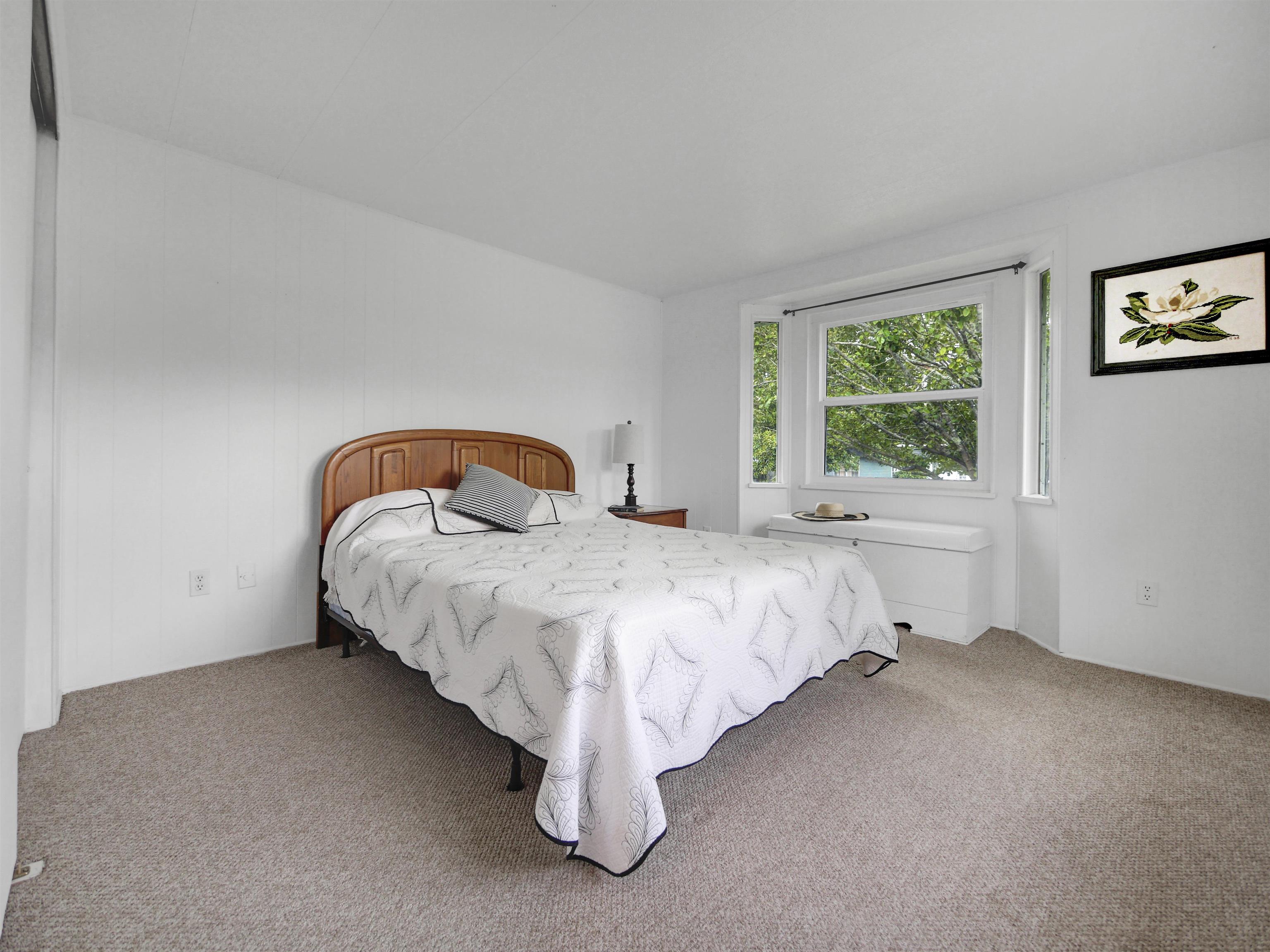 879 Palermo Road St. Augustine, FL 32086 - Photo 12 of 38 a bed sitting in a bedroom next to a window