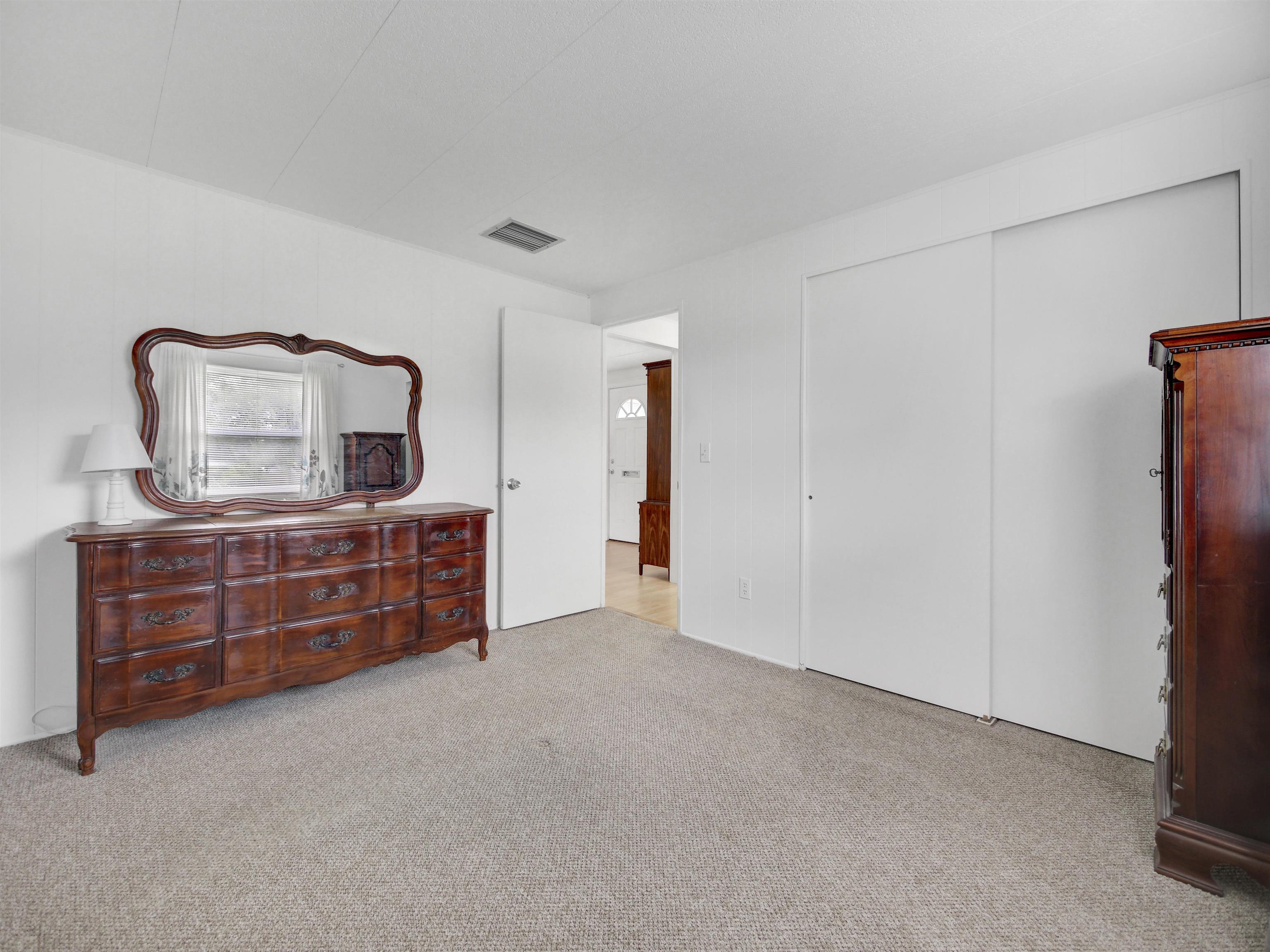 879 Palermo Road St. Augustine, FL 32086 - Photo 15 of 38 a room with furniture and mirror