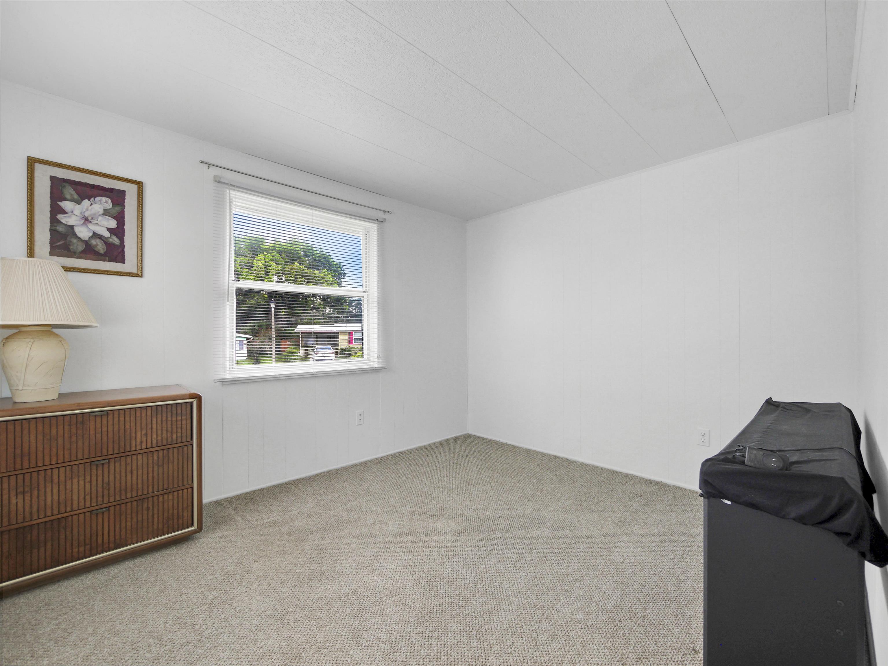 879 Palermo Road St. Augustine, FL 32086 - Photo 18 of 38 a living room with furniture and a window