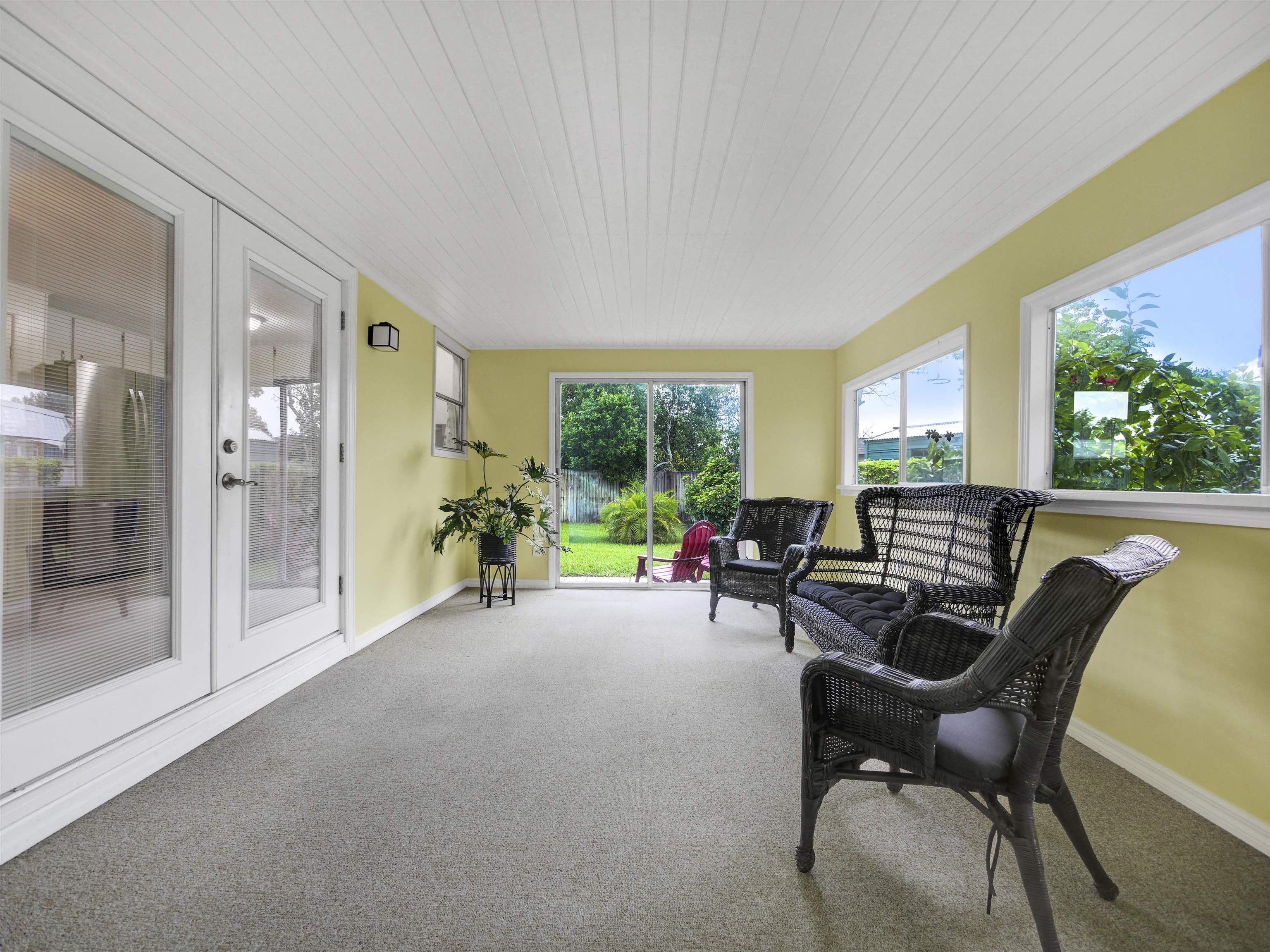 879 Palermo Road St. Augustine, FL 32086 - Photo 21 of 38 a living room with furniture and a floor to ceiling window