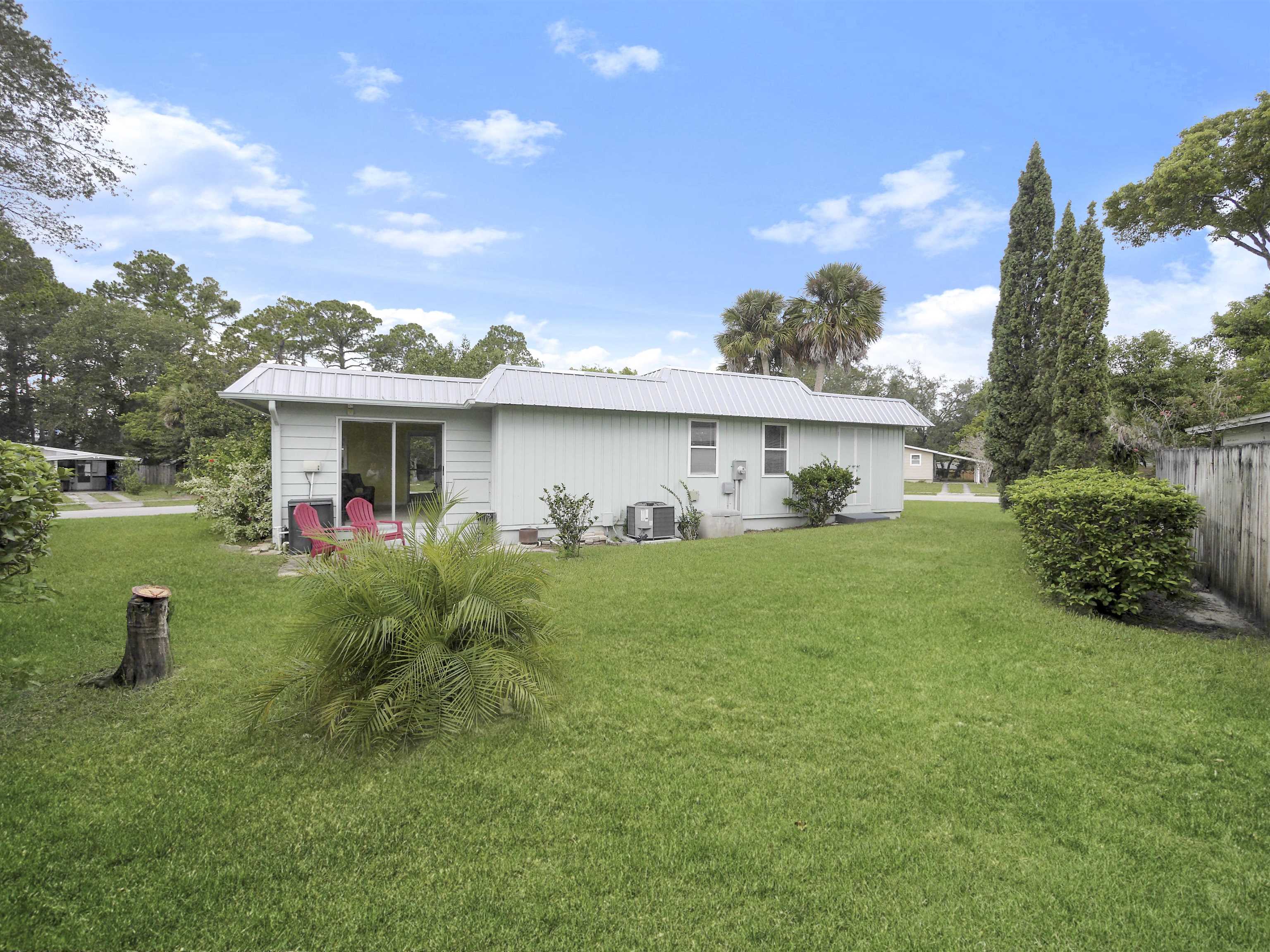879 Palermo Road St. Augustine, FL 32086 - Photo 25 of 38 a front view of a house with a yard