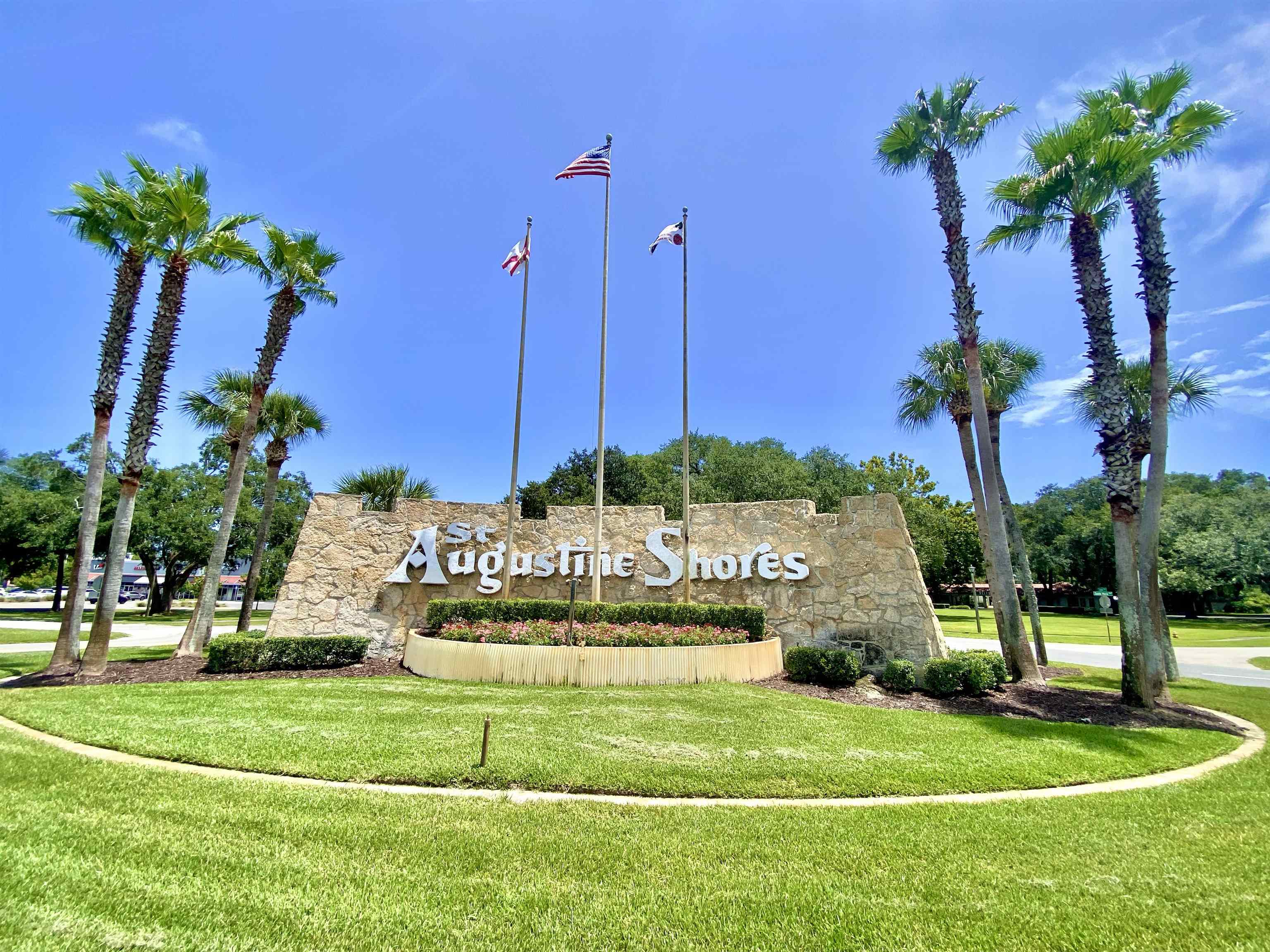 879 Palermo Road St. Augustine, FL 32086 - Photo 30 of 38 a front view of multi story residential apartment building with yard