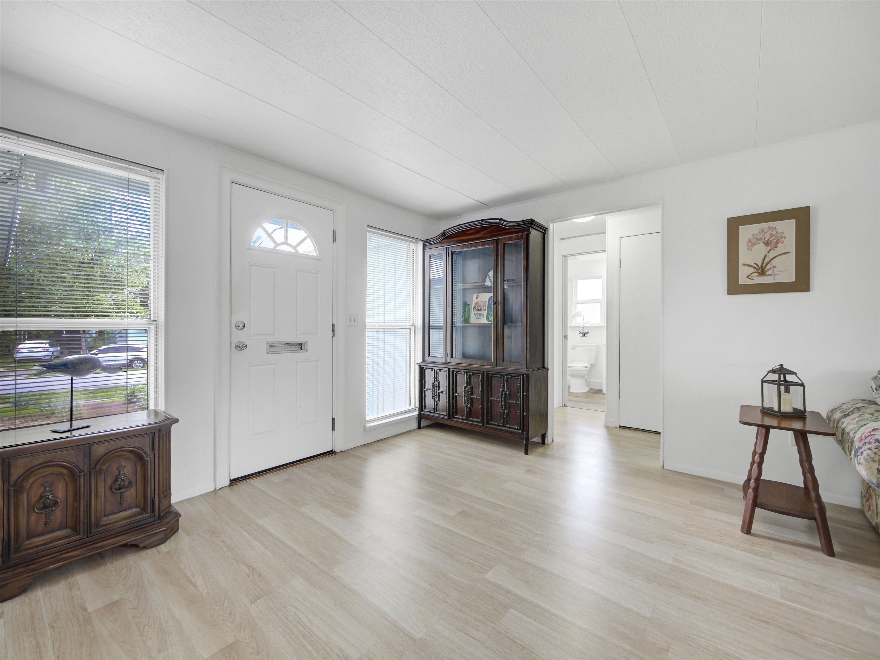 879 Palermo Road St. Augustine, FL 32086 - Photo 6 of 38 a view of an empty room with window and hardwood floor
