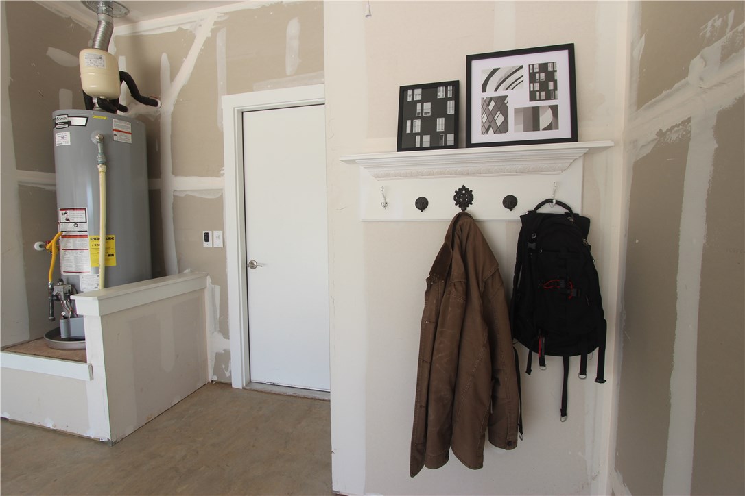 100 Century Plant Road Leander, TX 78641 - Photo 23 of 36 Custom backpack rack and coat/key organizer in the garage.