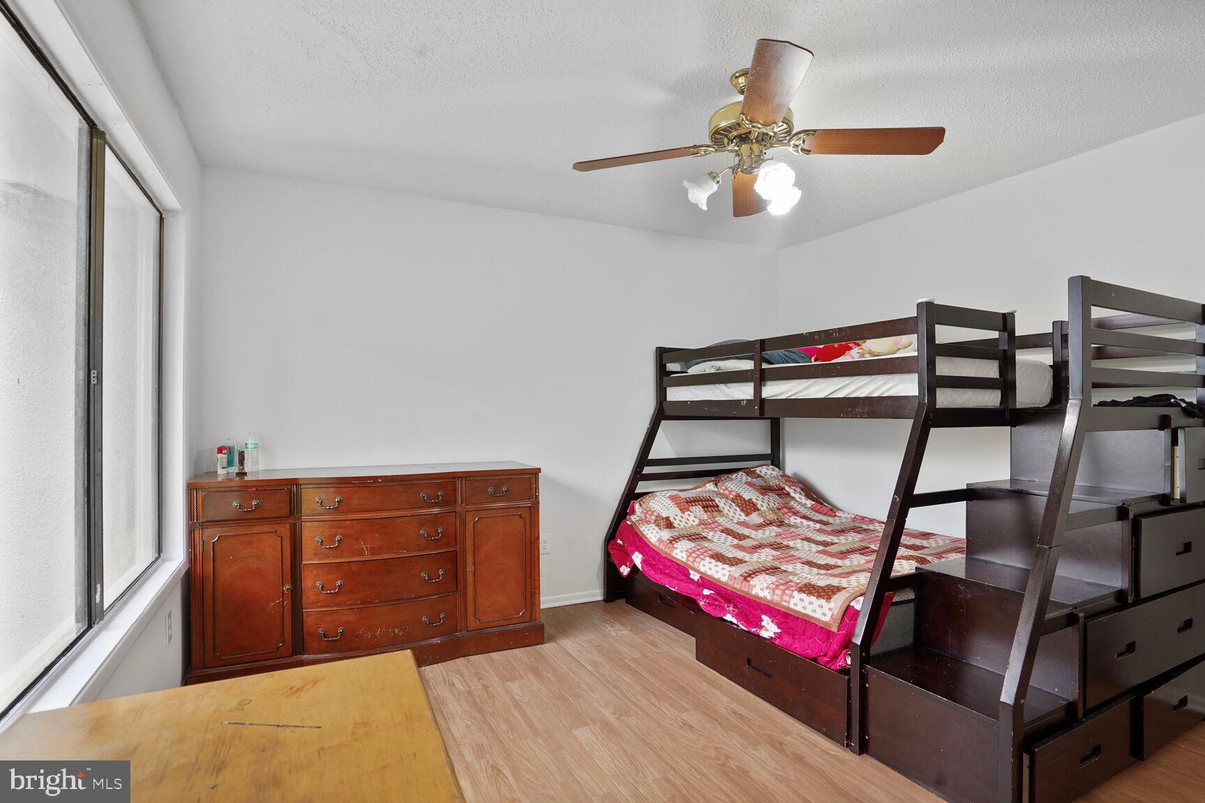 2412 Southgate Square Reston, VA 20191 - Photo 19 of 34 a bedroom with furniture and window