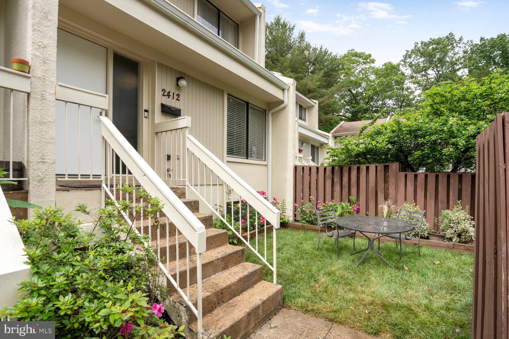 2412 Southgate Square Reston, VA 20191 - Photo 2 of 34 a view of a house with backyard and sitting area