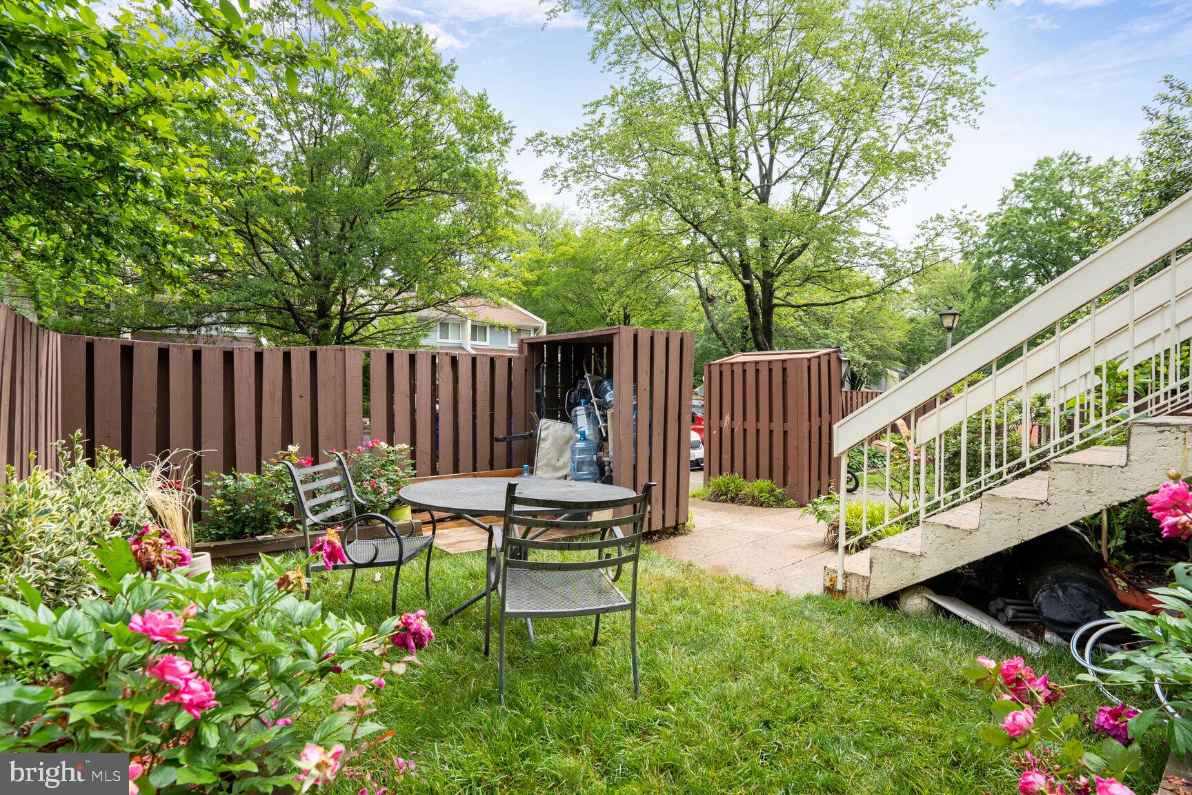 2412 Southgate Square Reston, VA 20191 - Photo 30 of 34 a view of a chair and table in the garden