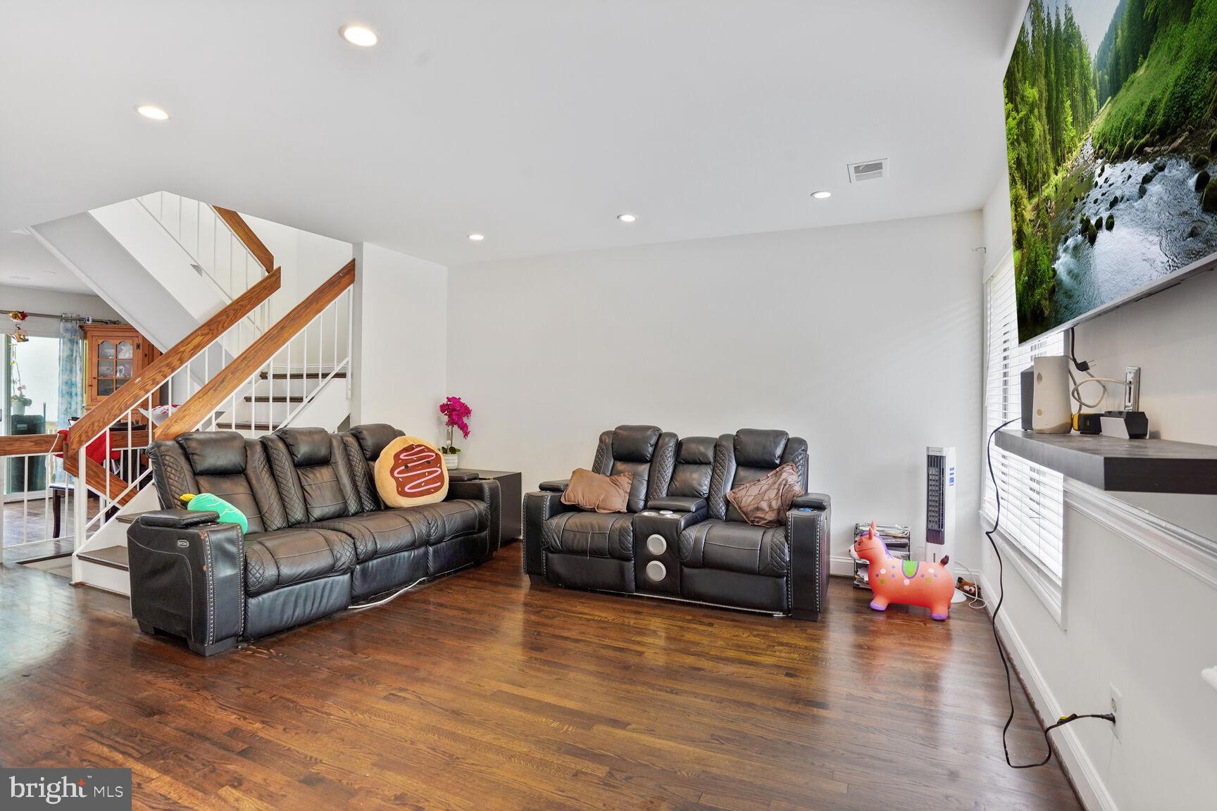 2412 Southgate Square Reston, VA 20191 - Photo 9 of 34 a living room with furniture and a flat screen tv