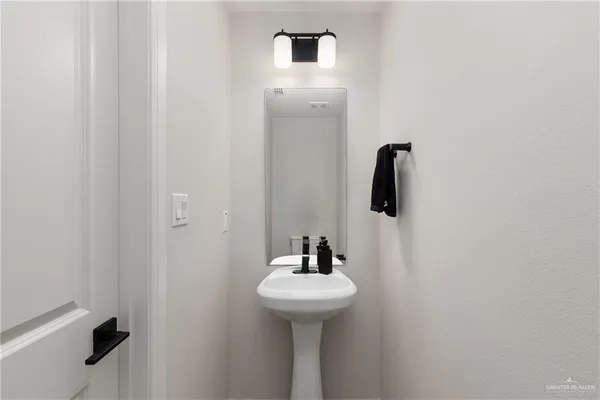 a bathroom with a sink and mirror