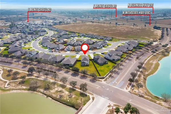 an aerial view of a house with a swimming pool