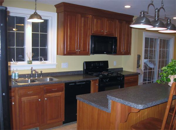 253 County Road Rochester, MA 02770 - Photo 14 of 30 a kitchen with a sink stove and microwave