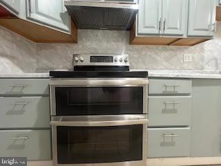 11064 Demarr Road White Plains, MD 20695 - Photo 50 of 98 a stove top oven sitting inside of a kitchen