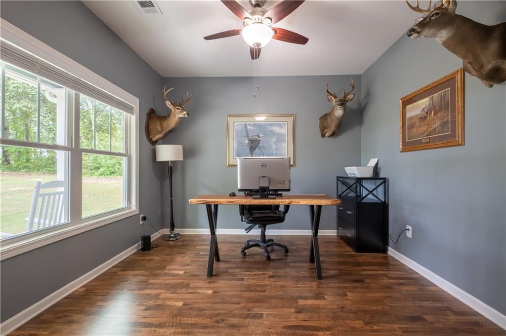 719 Fairview Road Brooks, GA 30205 - Photo 8 of 35 a workspace with wooden floor