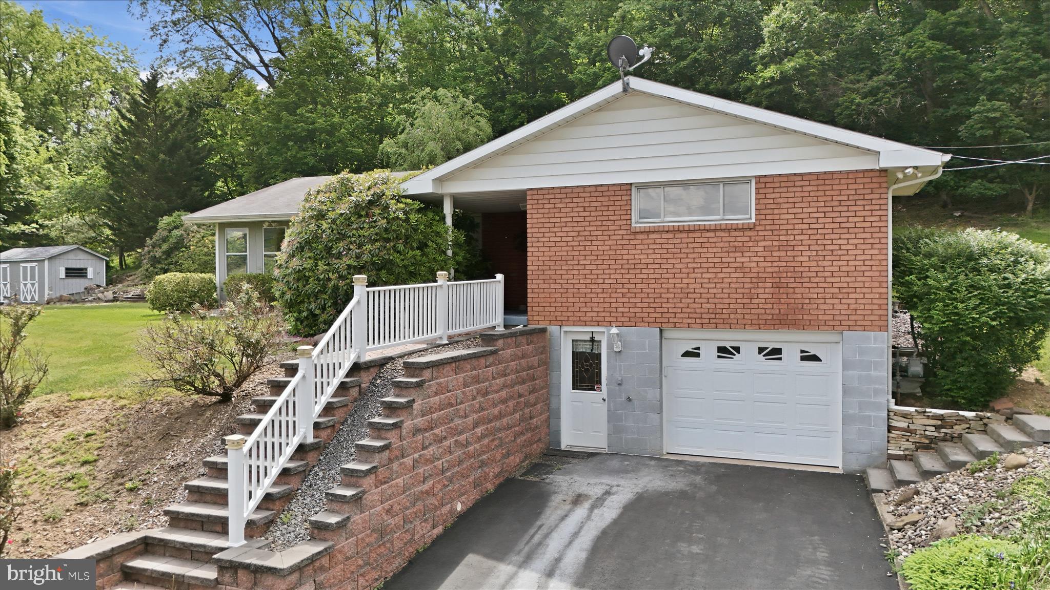 199 Buser Street Ridgeley, WV 26753 - Photo 2 of 49 a view of a house with a yard and balcony