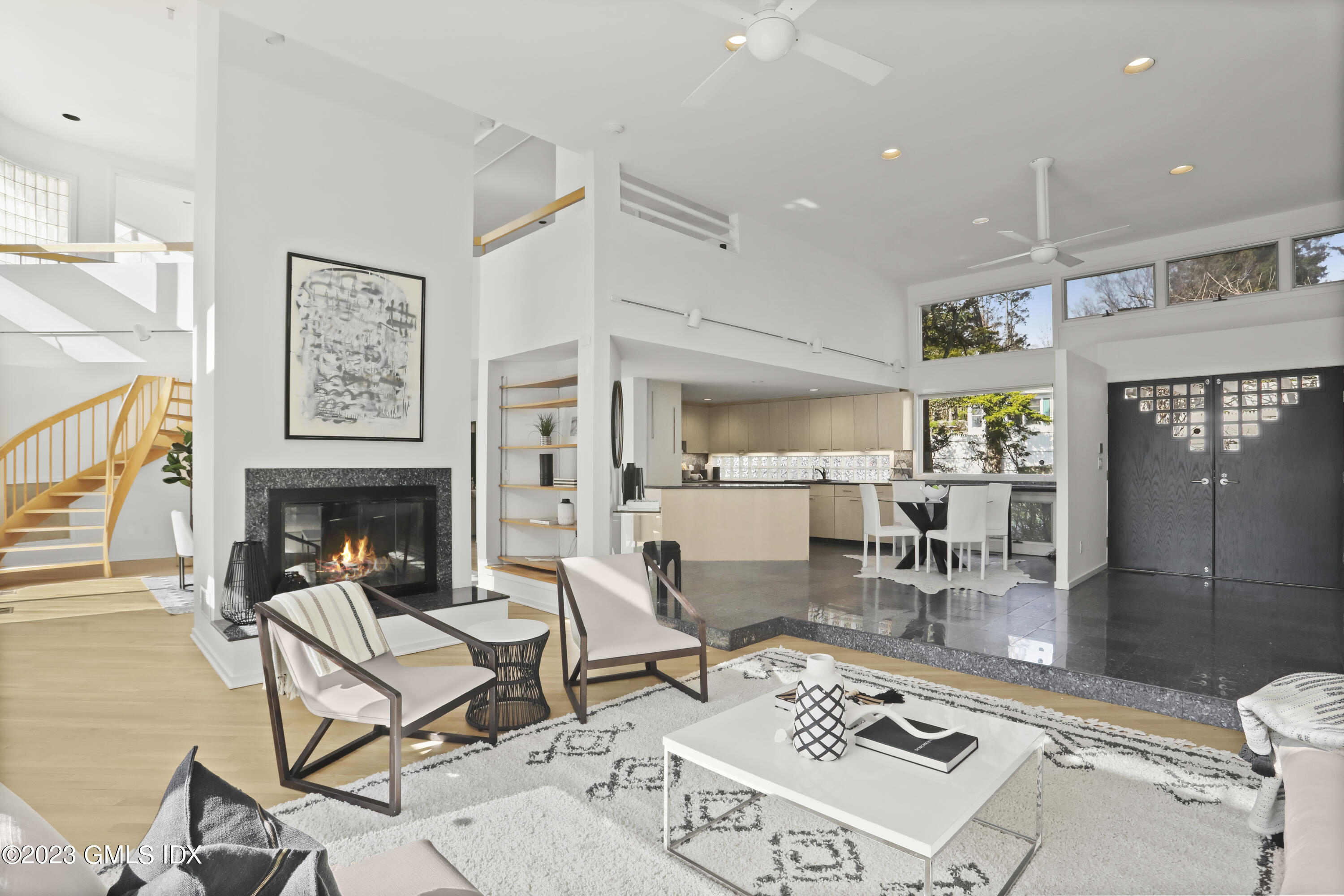 533 Cognewaugh Road Cos Cob, CT 06807 - Photo 3 of 21 a living room with furniture a fireplace and dining table